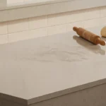 Caesarstone ICON 4201 Organic Dune beige surface featured in a modern restaurant interior with a pizza oven island 
